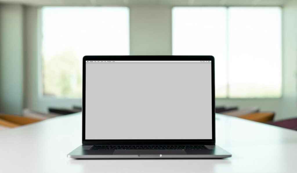 Macbook pro on white table