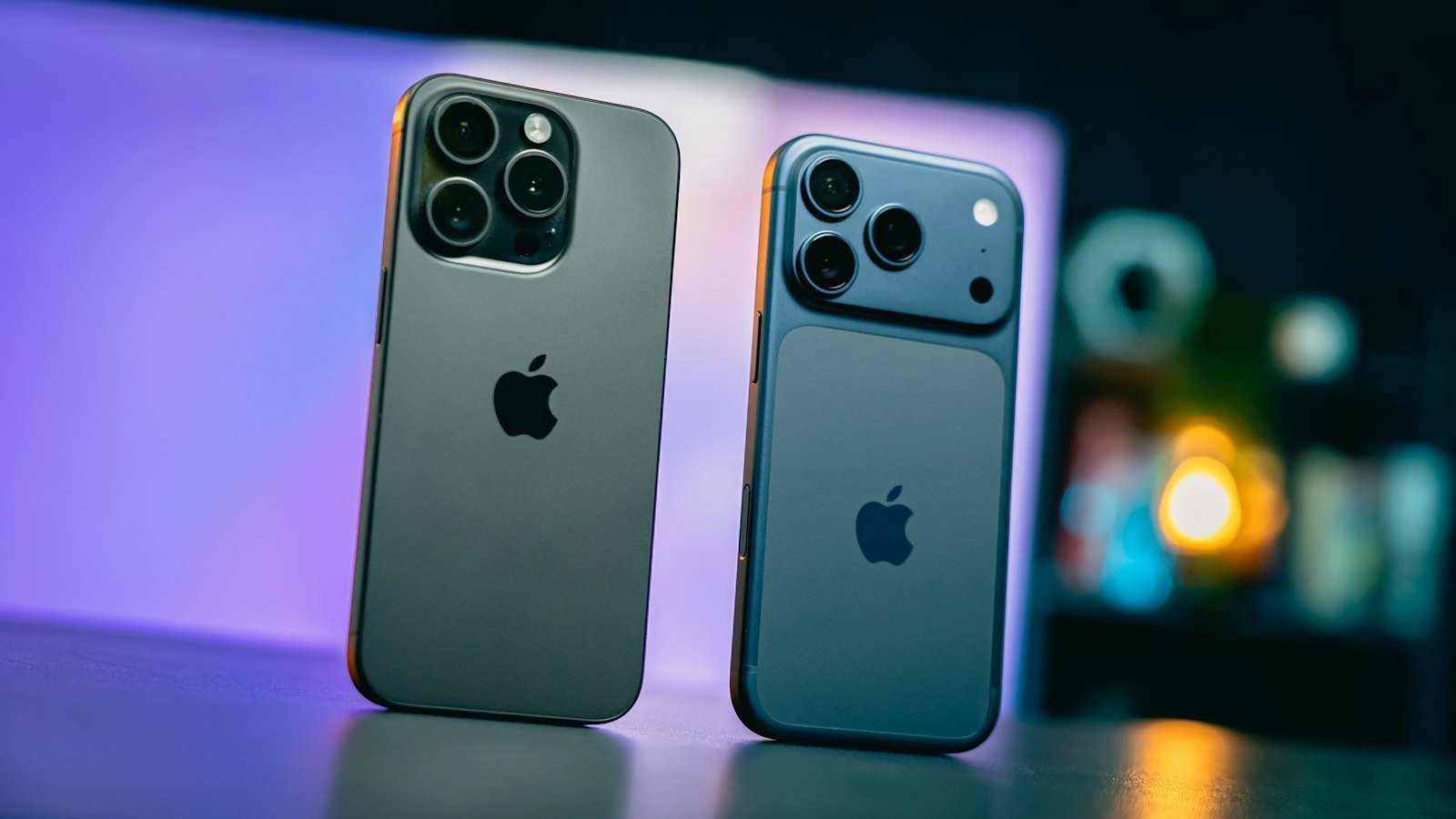 Two iPhones on a colourful background