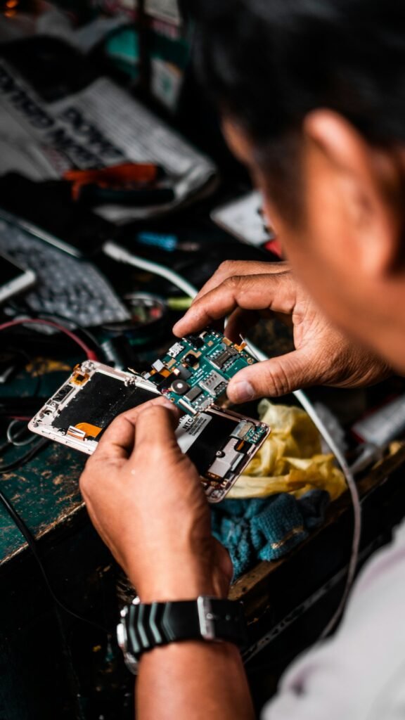 Man repairing Android smartphone